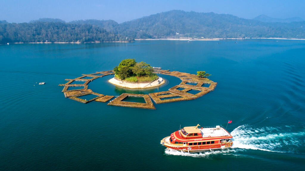 Floating docks and fields surround the island